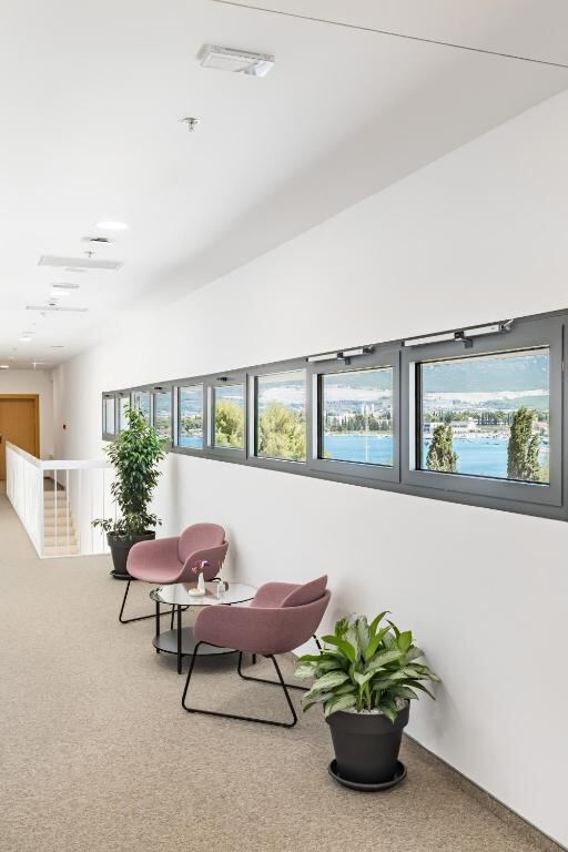 Bright lounge area with sea views inside the hotel
